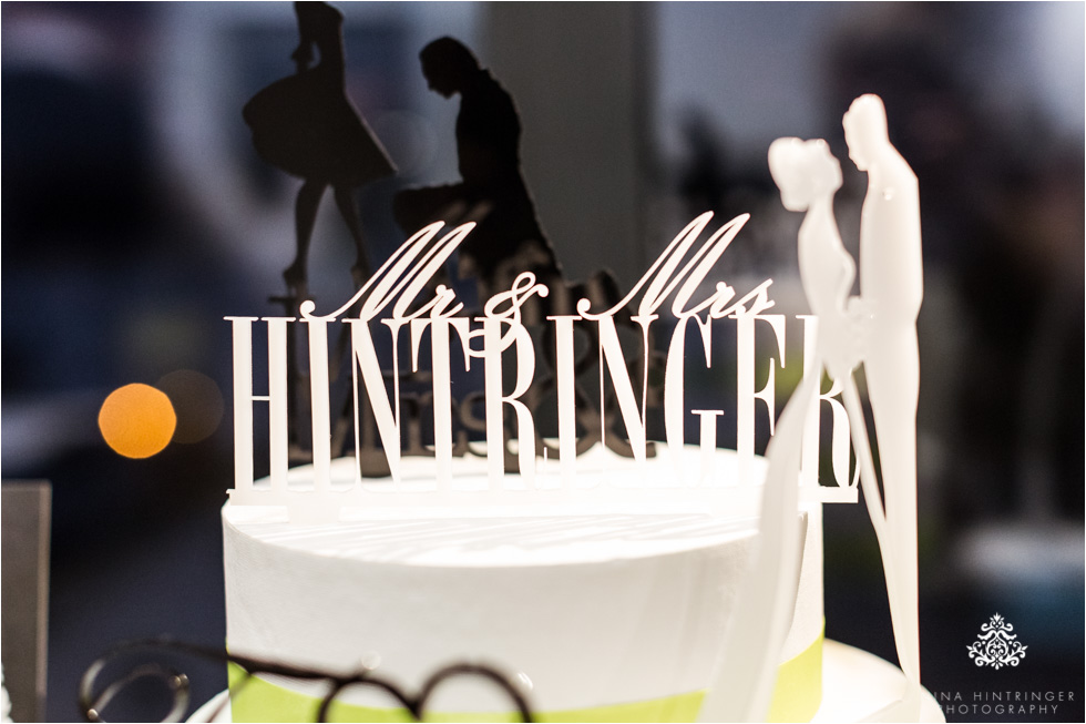 Customizable cake topper cut out of white acryl glass with the name of the bridal couple - Blog of Nina Hintringer Photography - Wedding Photography, Wedding Reportage and Destination Weddings